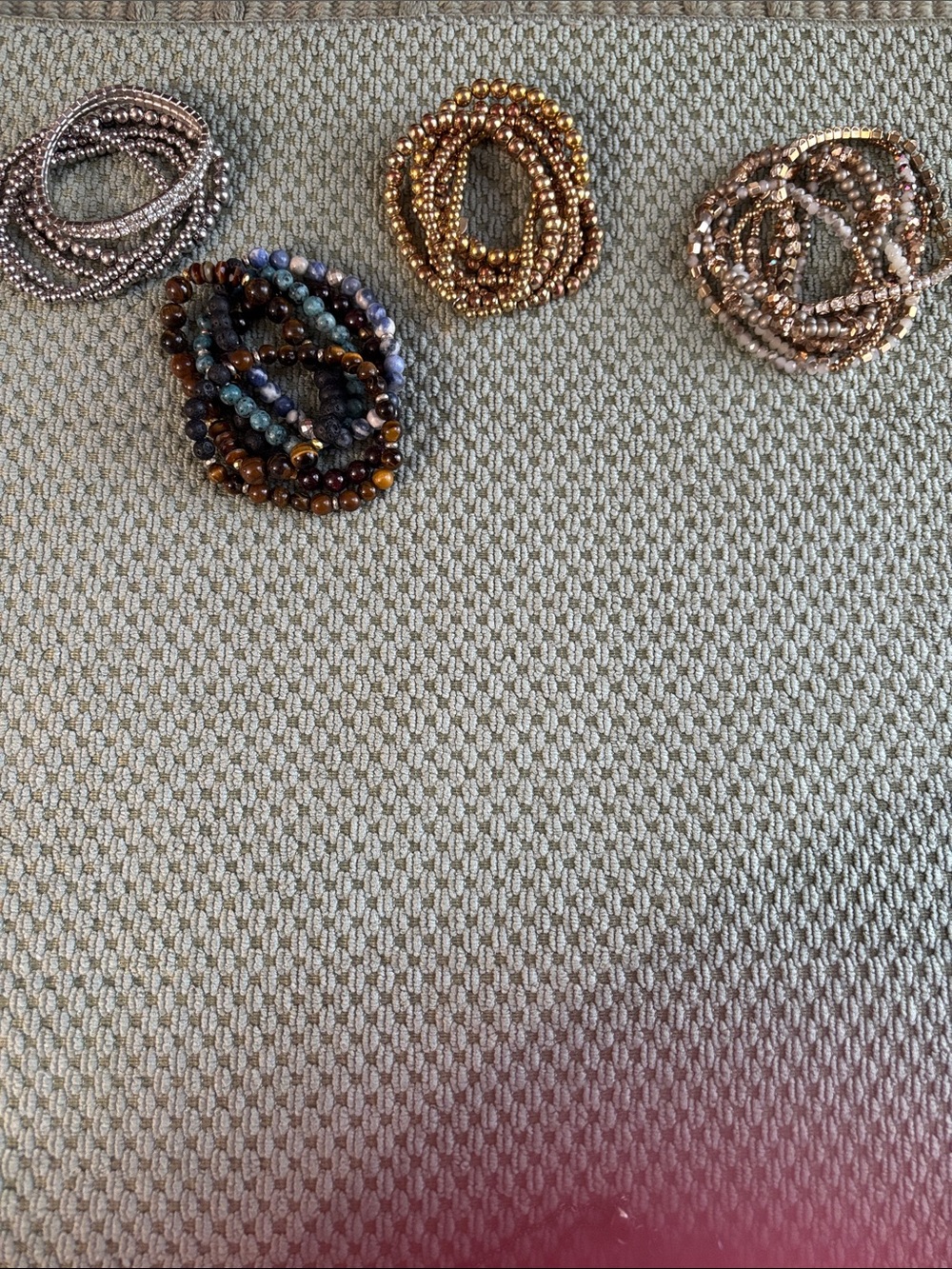 Four sets of stacking bracelets